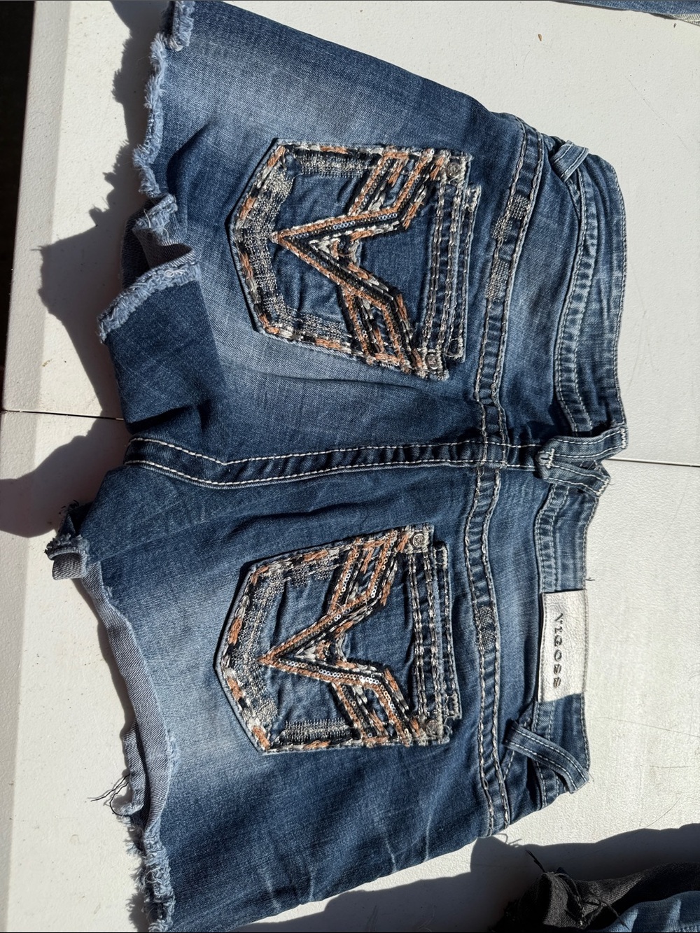 Vigoss Blue Denim Women's Frayed Hem Shorts with Embroidered Back Pockets
